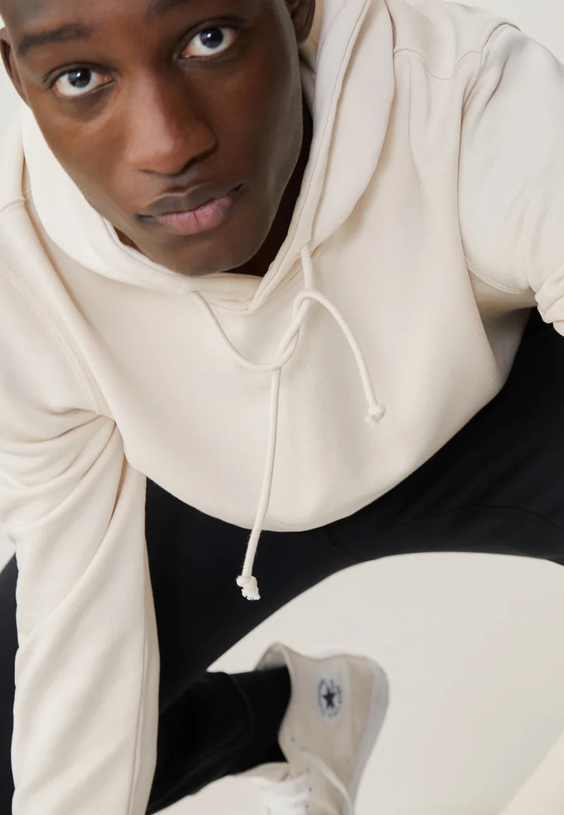 Le sweat à capuche
