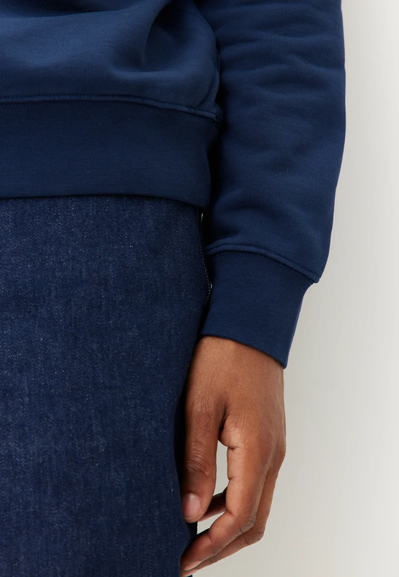 Le sweat à capuche