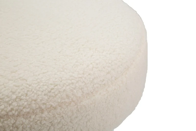 Table basse ronde rembourrée crème avec détails dorés