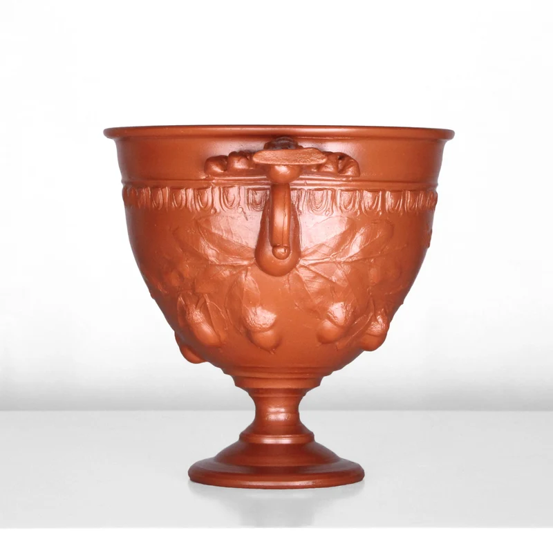 Tasse à vin romain avec reliefs de glands et manche - céramique sigillée