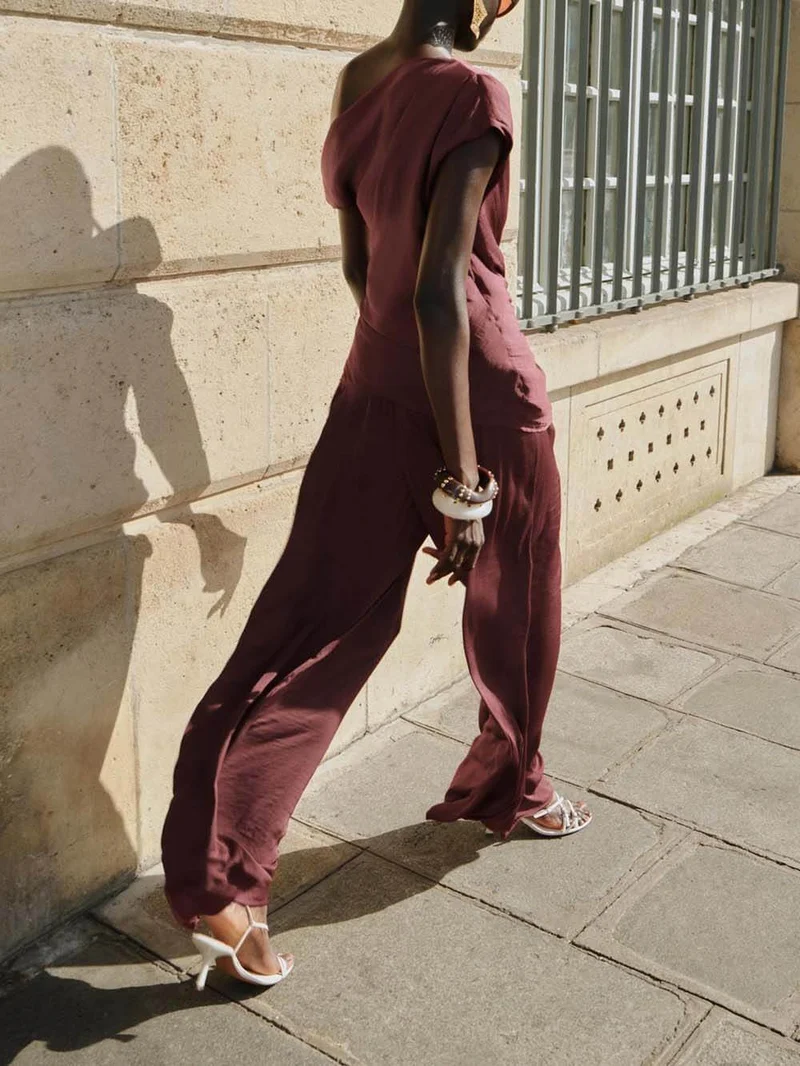 Unique Asymmetric Hem Metallic Accents Top