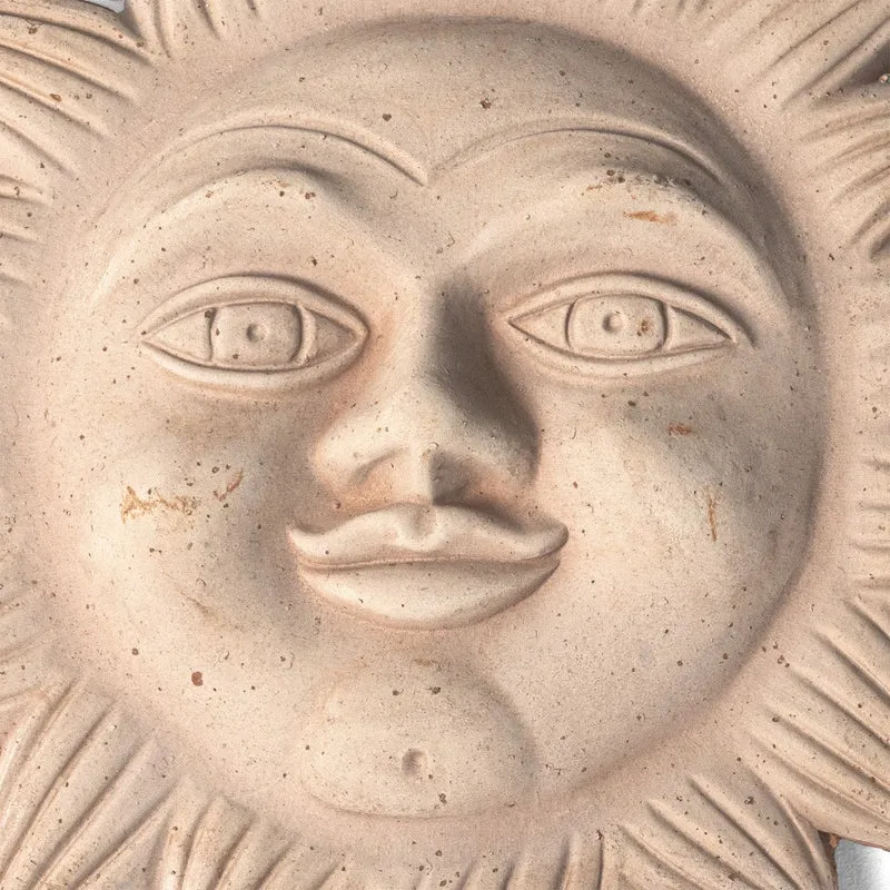 Bas-relief soleil italien en terre cuite