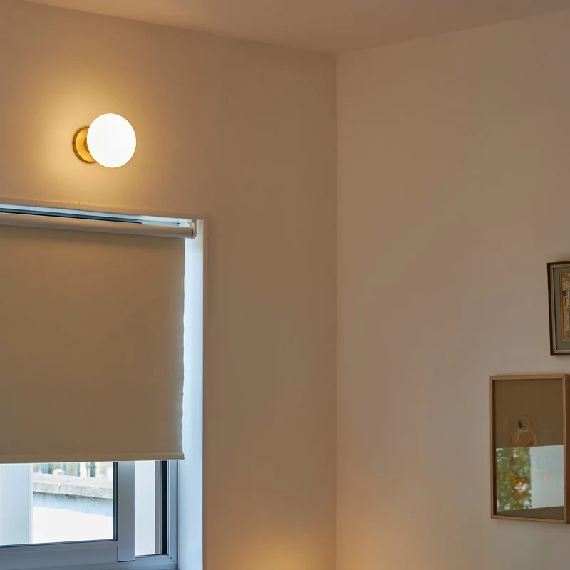 Lochan Wall Light in Brass + Oval Dim to Warm