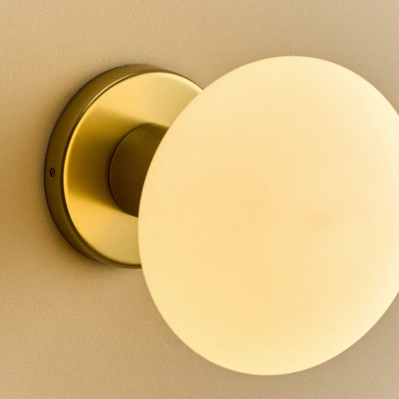 Lochan Wall Light in Brass + Oval Dim to Warm