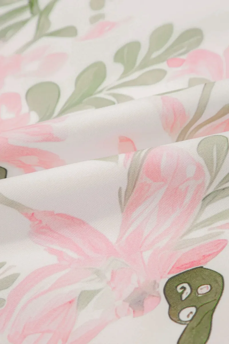 Mini-robe à manches courtes et bordures contrastées à fleurs
