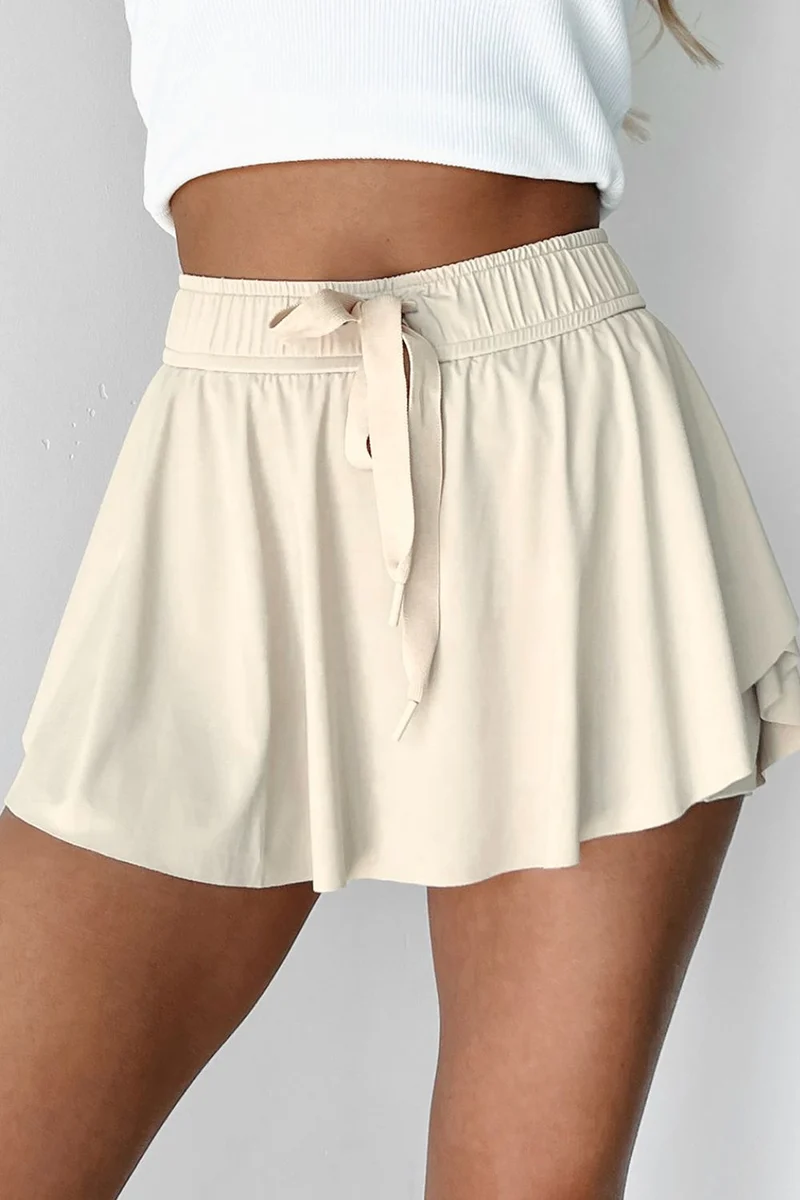 Jupe-short de sport doublée taille haute avec cordon de serrage