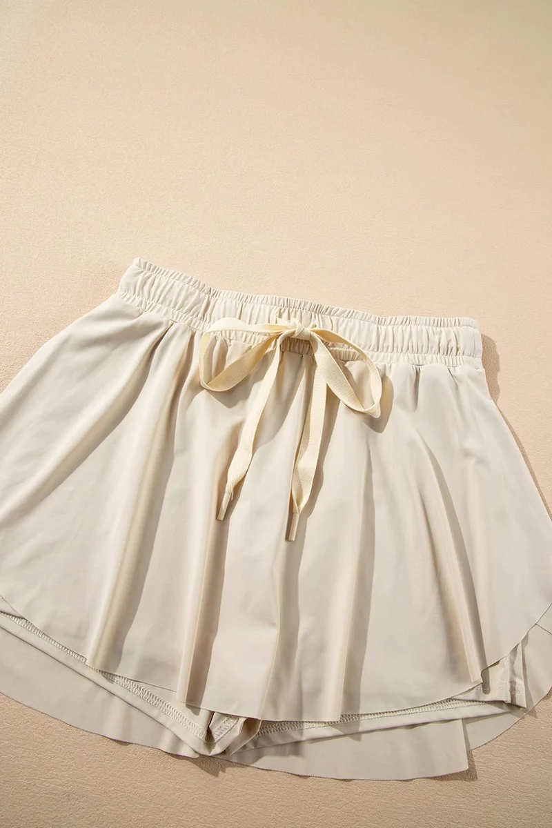 Jupe-short de sport doublée taille haute avec cordon de serrage