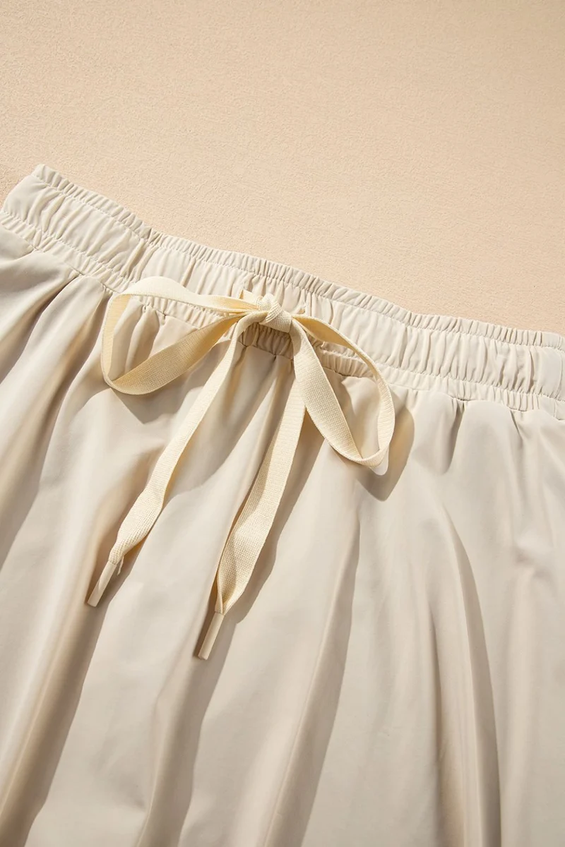Jupe-short de sport doublée taille haute avec cordon de serrage