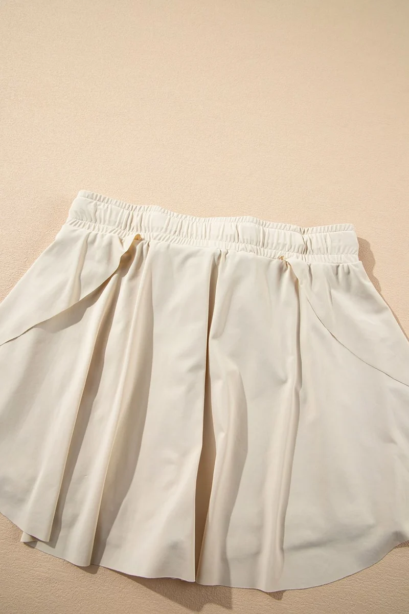 Jupe-short de sport doublée taille haute avec cordon de serrage
