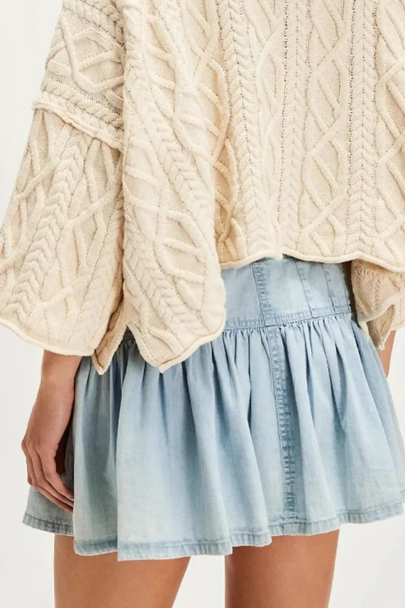 Mini-jupe en jean boutonnée à volants