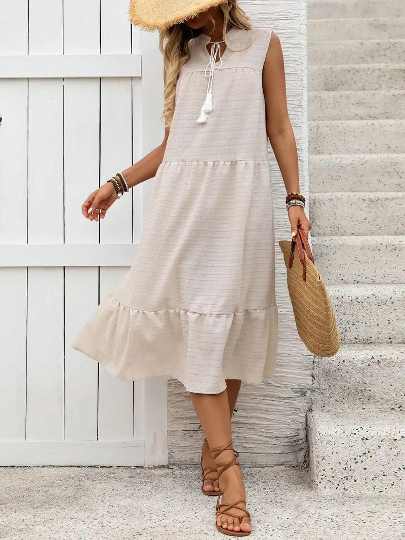 Robe sans manches à col noué et ourlet à volants