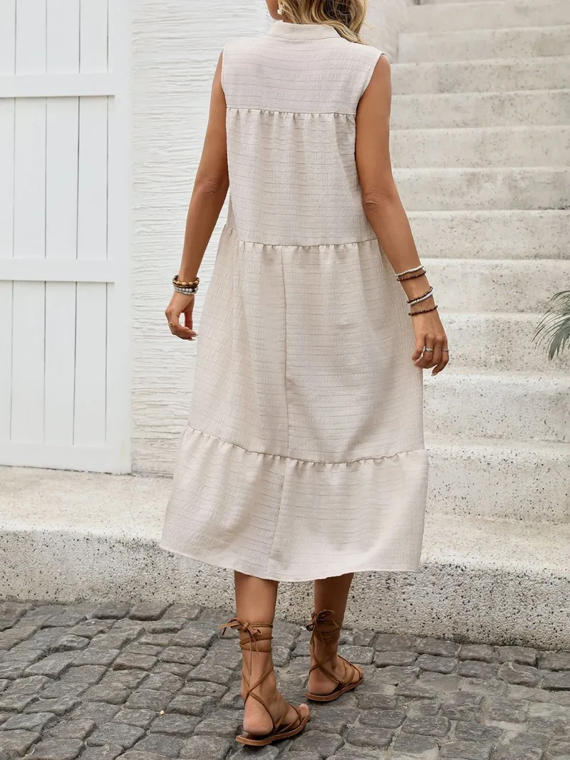 Robe sans manches à col noué et ourlet à volants