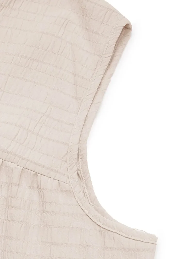 Robe sans manches à col noué et ourlet à volants